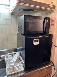 電子レンジ
冷蔵庫 - のんびりサロン 五反田店の設備の写真